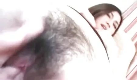 Blonde with elastic buffers posing on the ocean