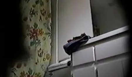 Dark-haired Lolita caresses crotch through tights