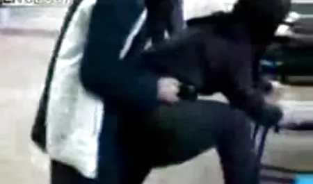 Mia caresses herself against the backdrop of a beautiful landscape