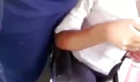 Chick tries on underwear in front of a mirror