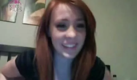 A girl in a maid's suit strapite a chained guy