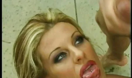 Randy Girl in blue latex passionately masturbates pussy