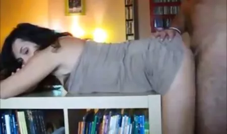 Girl with pigtails is spying in the posture of