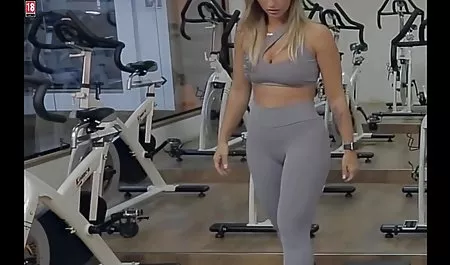 Girl with beautiful breasts posing in the pool