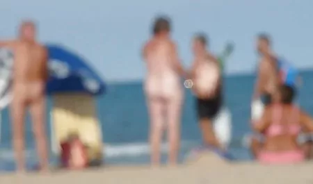 A hooker in a pink with two guys