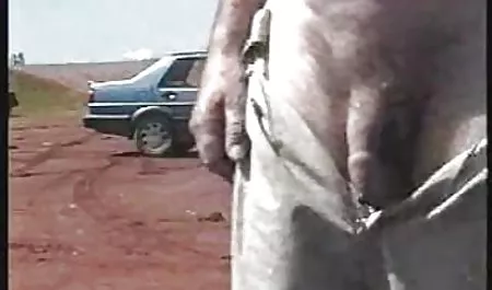 A nice little brunette stayed in a stockings of black color and talking on the phone