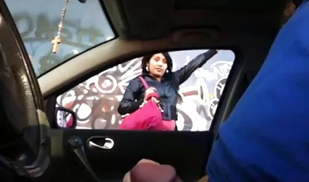 Adult woman sits squatting and shows hairy pussy