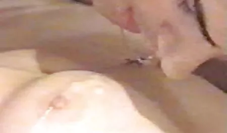 Young couple frolic in bathing suits in water