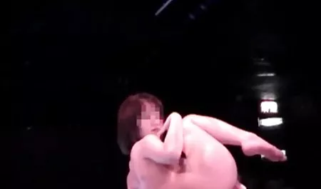 Charming brunette in oil in front of the camera