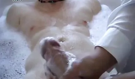 Dude playing with a blond blonde doll in school uniform