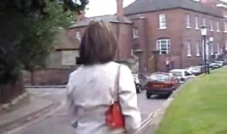 Redhead babe sexy posing and rubs a Dillon in shaved kitty