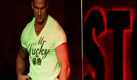 A muscular male took off a stripper to be seen in front of others