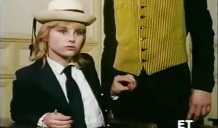 A kid shoots on a nudist beach