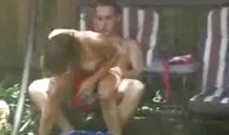 The girl is using a rubber fallos through the tights